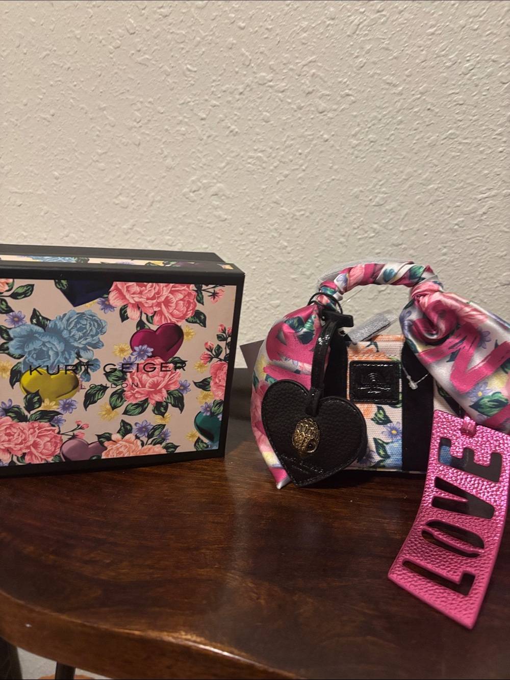 Kurt Geiger Floral Mini Bag with Pink LOVE Strap and Heart Charm